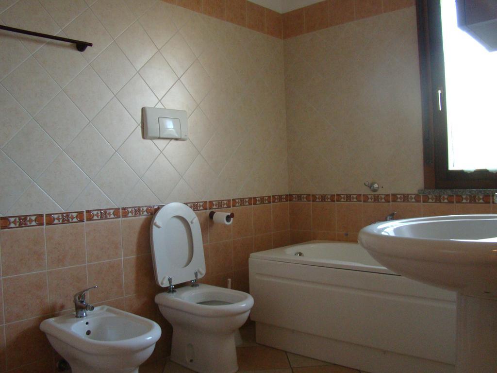 Appartamento Deledda Muravera Szoba fotó